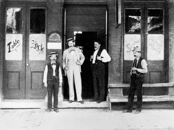 #25 Men standing in front of a saloon called “Table Rock”, 1890s.