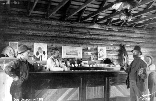 #35 A man pulls a gun at the White Dog Saloon in Fort Worth, Texas, in 1898.