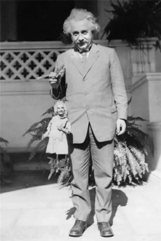 #8 Standin’ (with a doll of himself)