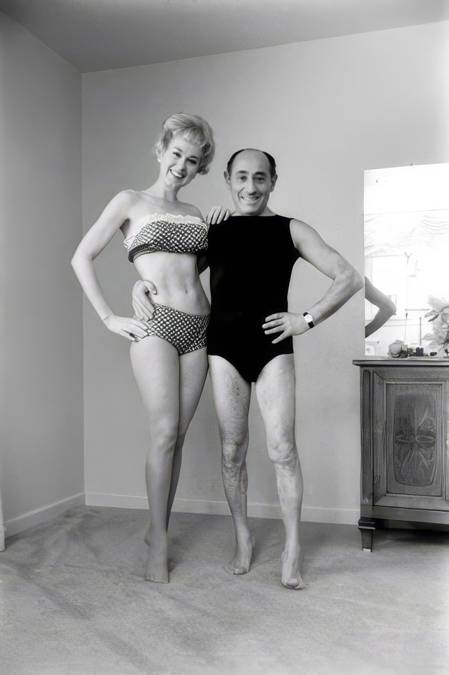#8 Alfred Eisenstaedt poses with “beauty culturist” and the first woman to star in her own daily exercise TV show, Debbie Drake, 1962.