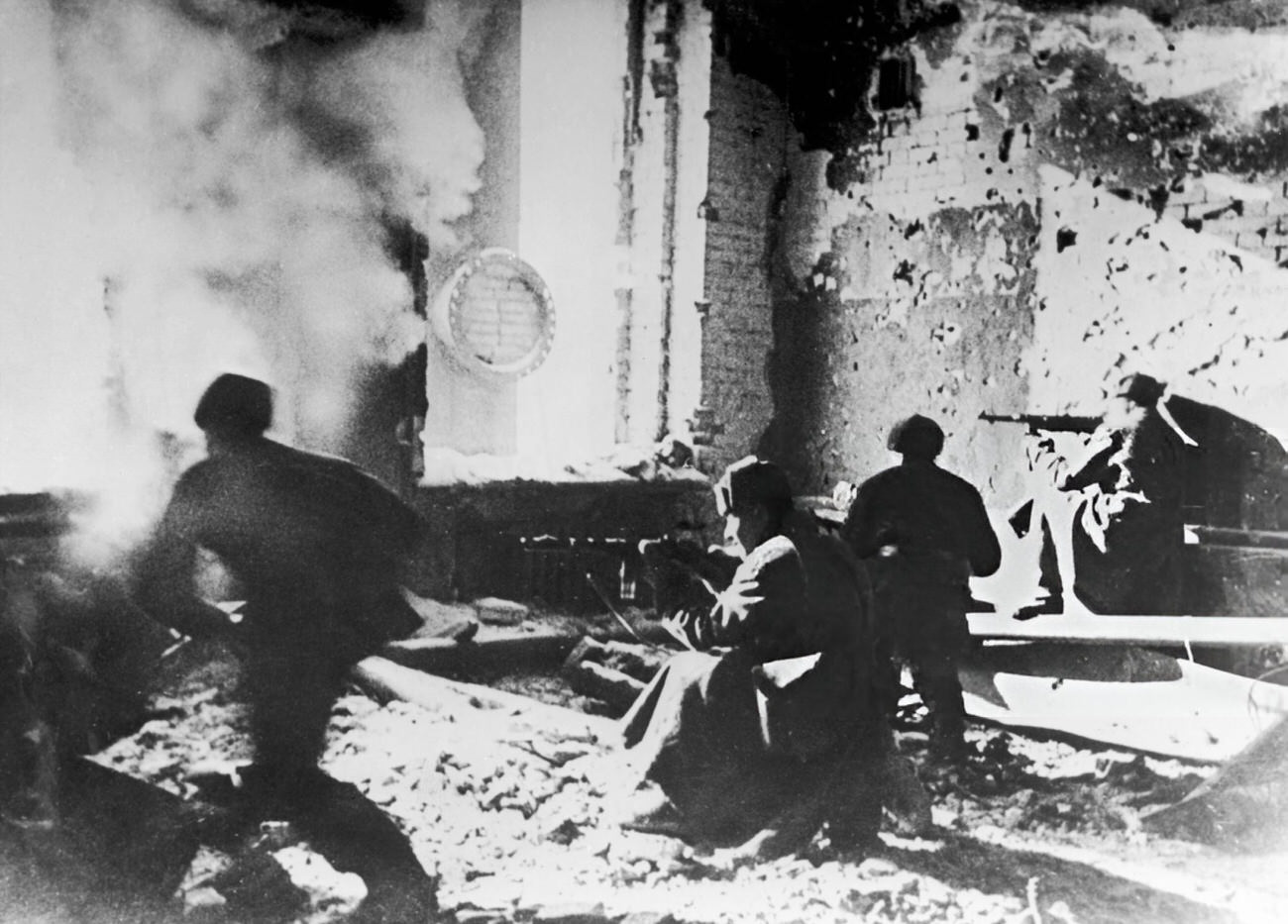 #15 Russian soldiers target the Germans from within an abandoned building during the Battle of Stalingrad, 1942.
