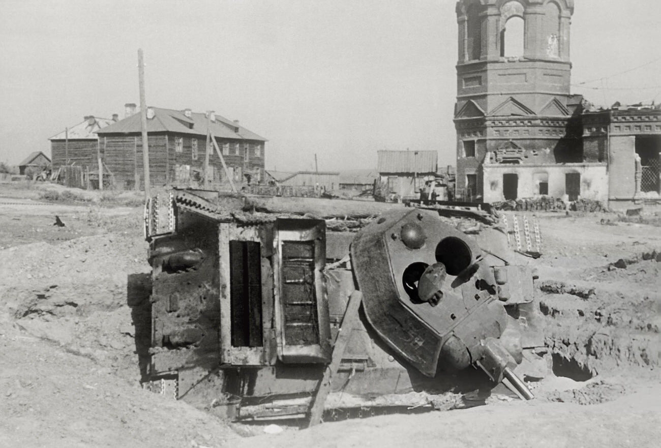 #50 The wreck of a Soviet tank abandoned in the outskirts of Stalingrad, 1942.