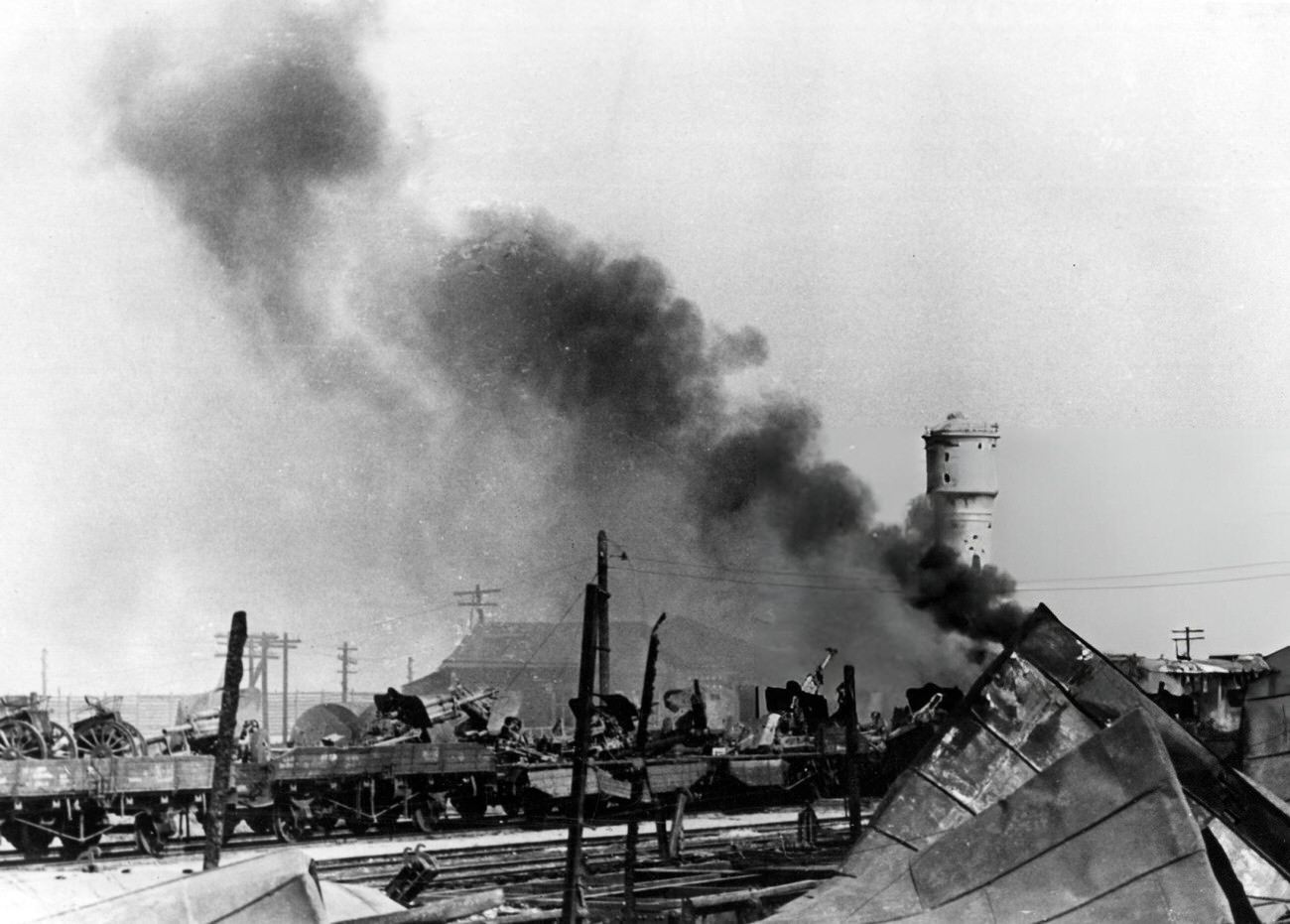 #55 Train loaded with Russian artillery in a station on fire in Stalingrad, 1942.