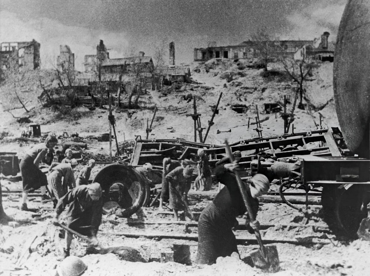 #6 Women digging near damaged train tracks during the Battle of Stalingrad, 1942.