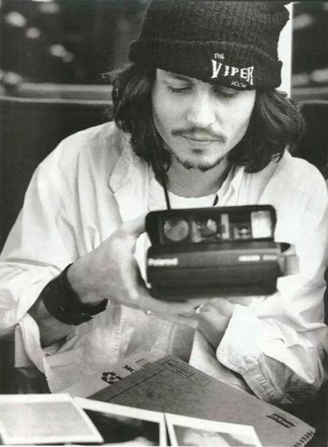 #28 Johnny Depp with a Polaroid