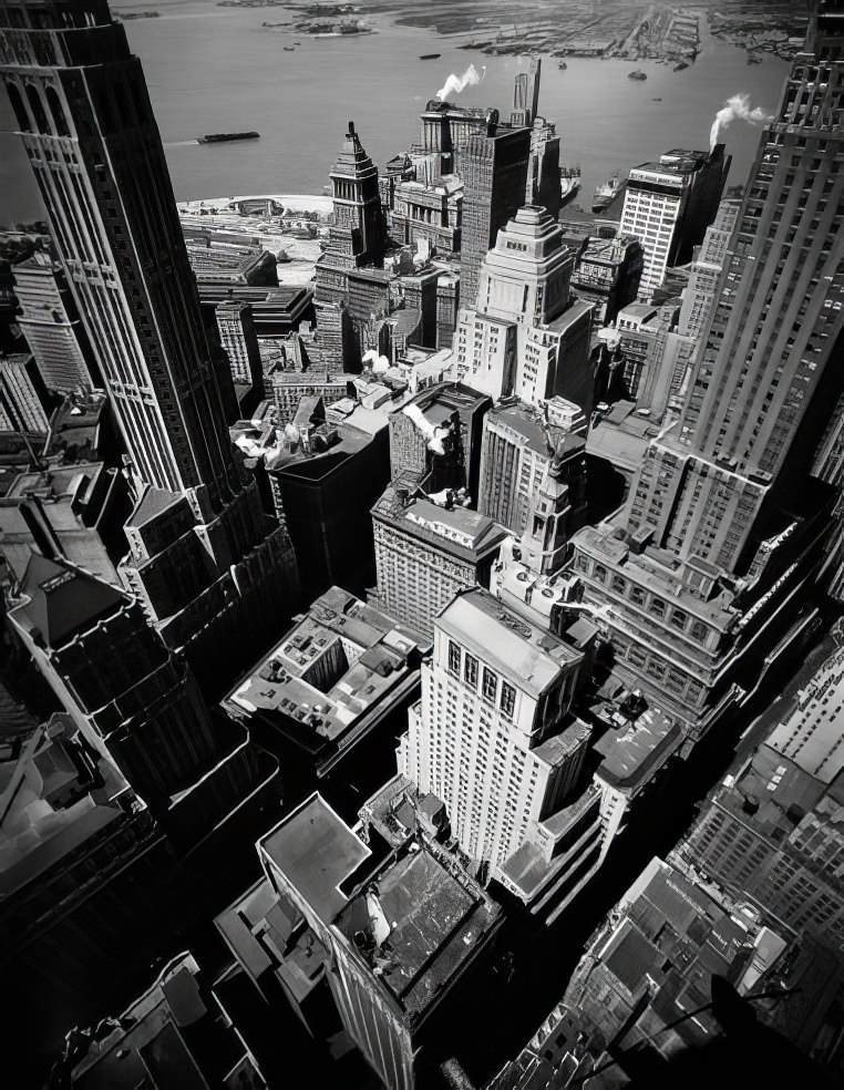 #12 Birds-eye view of Lower Manhattan looking southeast towards Battery Park with Ellis Island beyond and the New Jersey waterfront in the distance, 1945.
