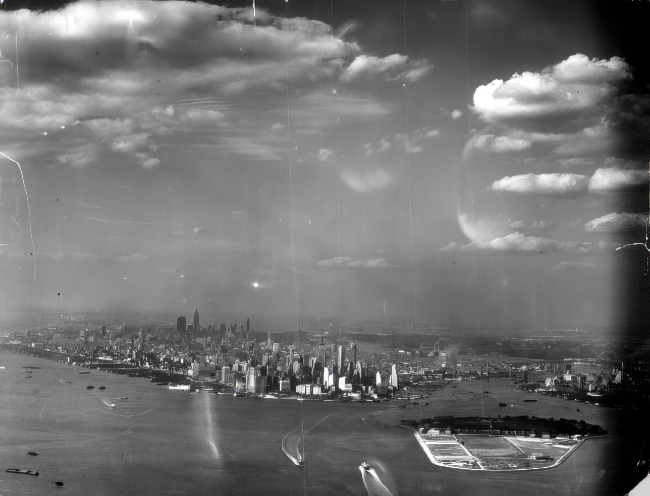#4 An aerial view, from the south, of Lower Manhattan, Governor’s Island, the harbor, the Hudson and East Rivers and New York City’s surroundings, 1939