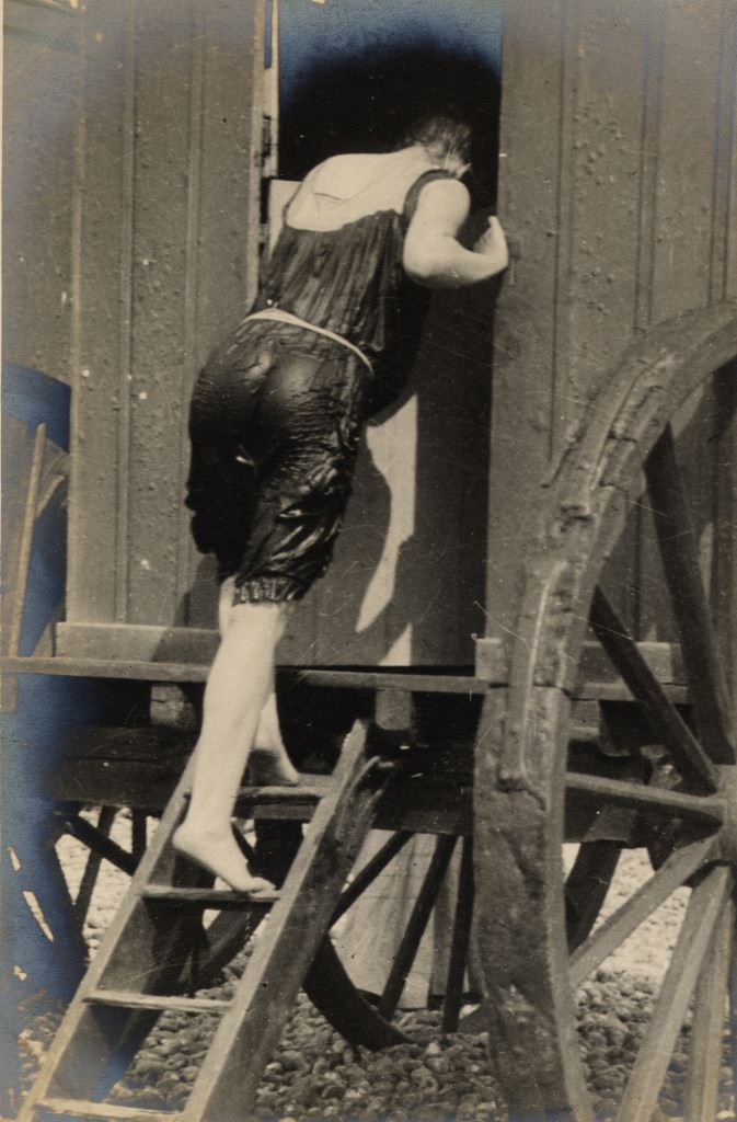 #6 A woman enters a bathing machine after a swim.