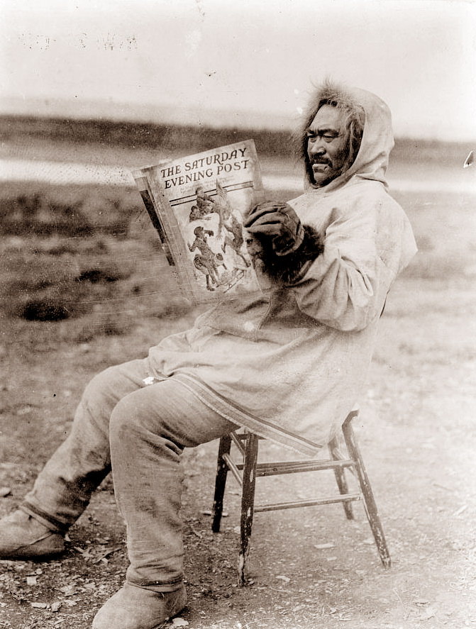 #1 Eskimo Man reading a copy of the Saturday Evening Post, 1913