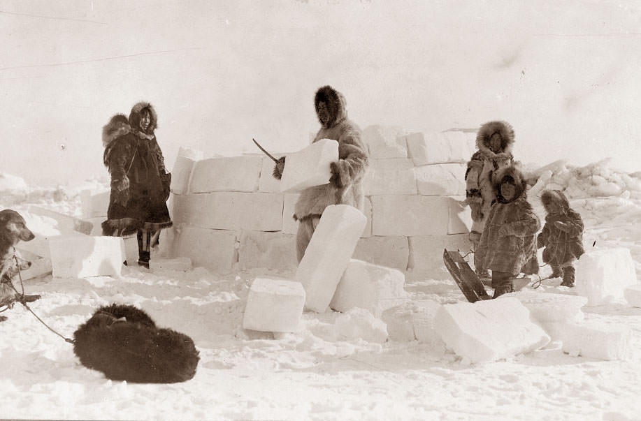 #2 An Eskimo Family building an igloo, 1924