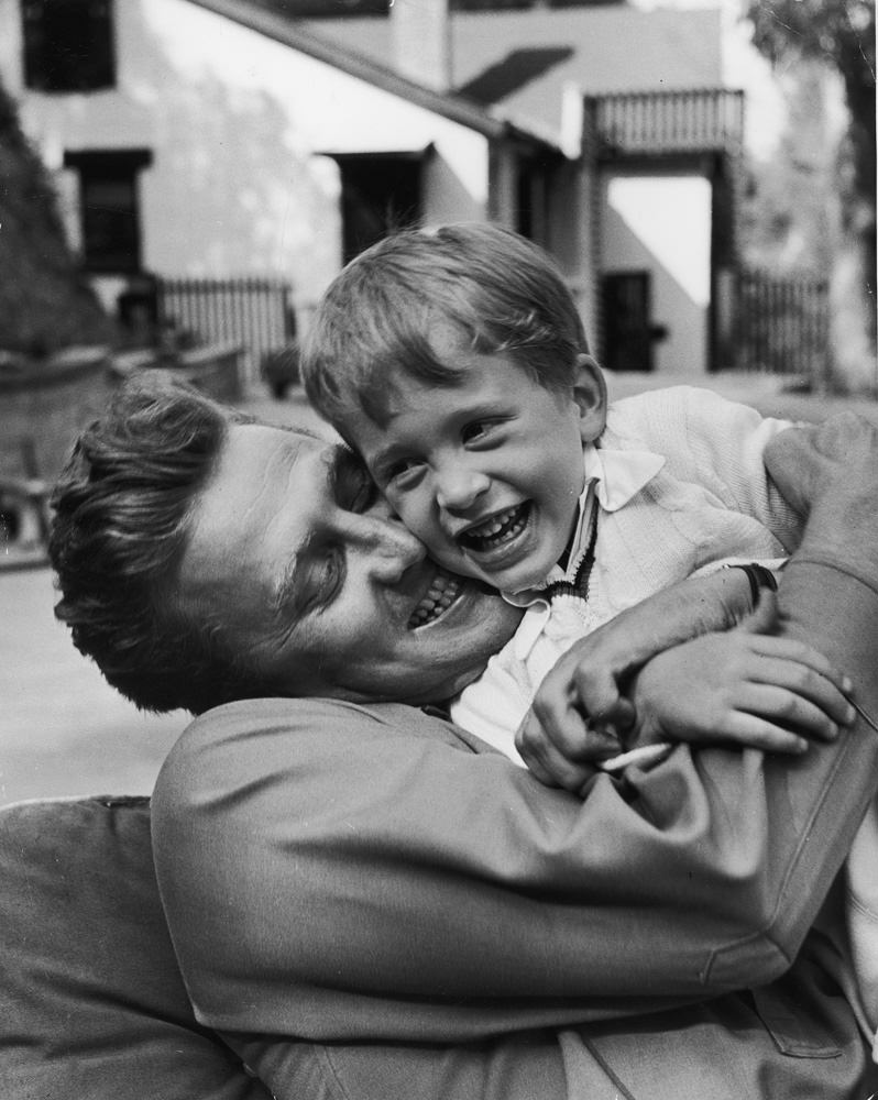 #2 Kirk Douglas hugs his son Michael, 1949.