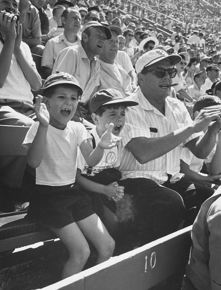 #6 Desi Arnaz cheers on the Dodgers while sitting next to his young son, Desi Jr., and child actor Richard Keith who played “Little Ricky” on “I Love Lucy”, 1958.