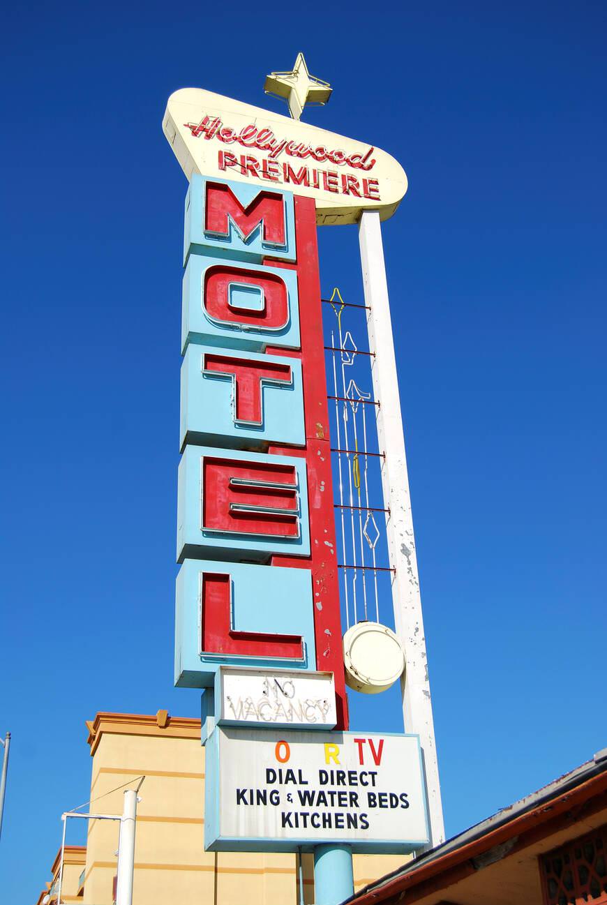 #13 Hollywood Premiere Motel sign on Hollywood Boulevard, 1950s.