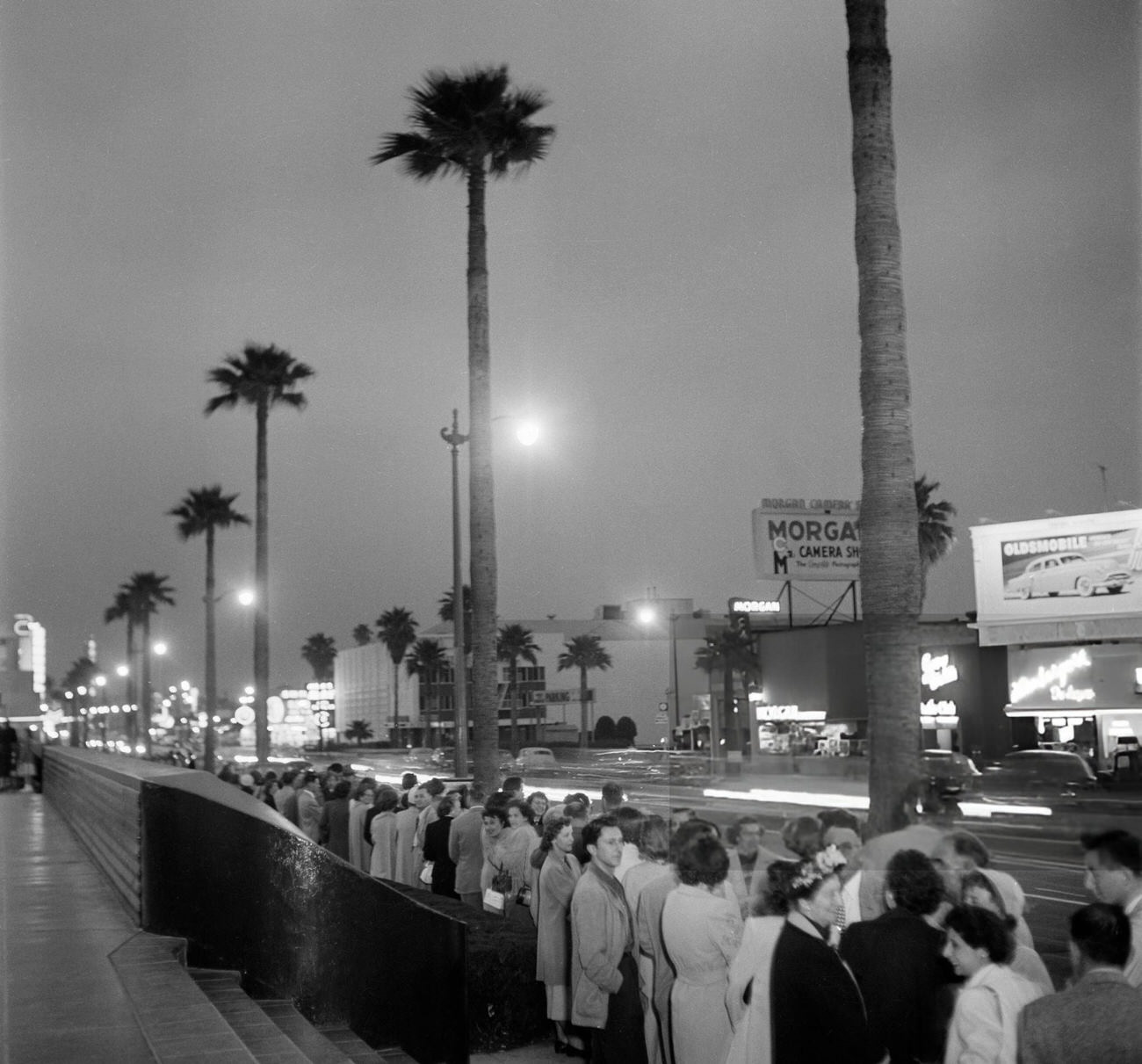 #24 People waiting to enter NBC Studios on Sunset Boulevard in Hollywood, California, 1951.
