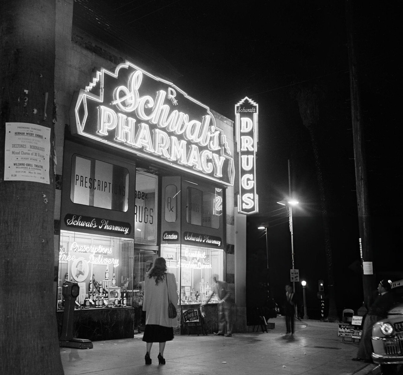 #33 A woman walking to Schwab’s Pharmacy on Hollywood Boulevard in Hollywood, California, 1951.