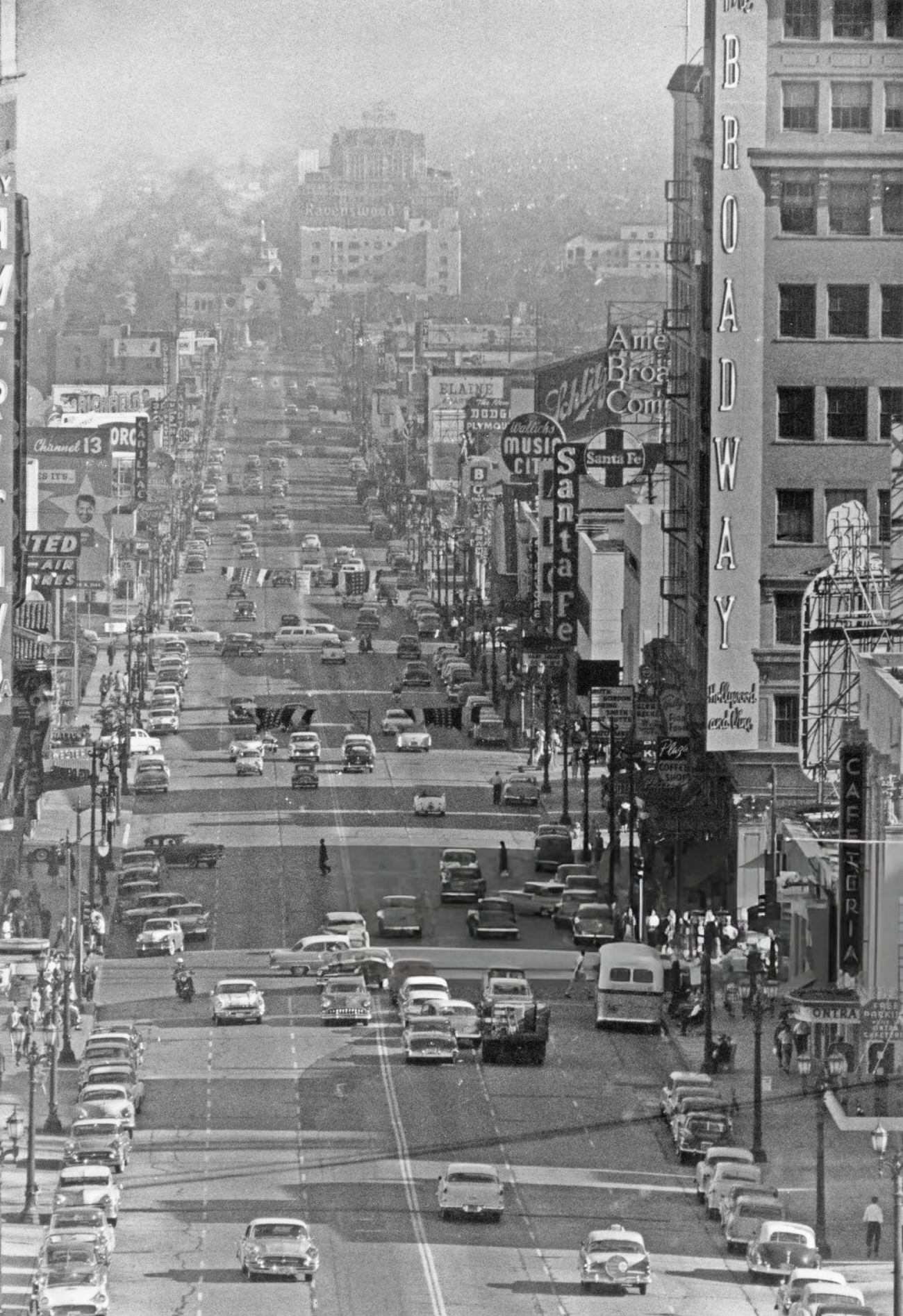 #43 Pedestrians and traffic on Hollywood and Vine in Hollywood, California, 1955.