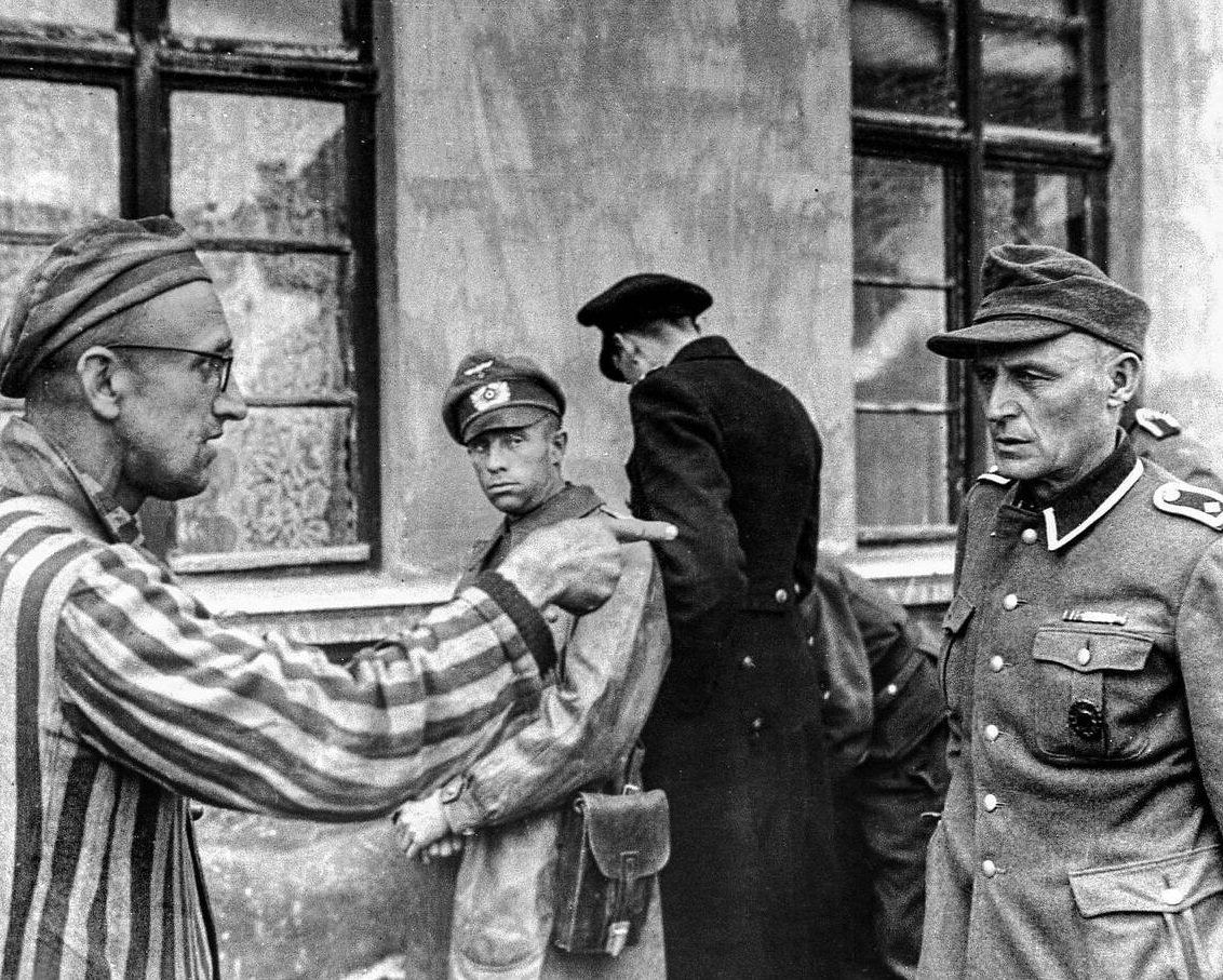 #8 A Jewish Russian survivor liberated in 1945 by the U.S. Army at the notorious Buchenwald concentration camp in Germany confronts and identifies a former guard from the Nazi SS, 1945.