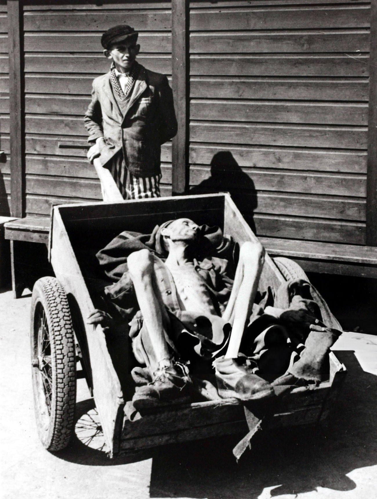 #24 The scene at Buchenwald, Germany, a Nazi concentration camp, after American troops had “liberated” the camp, 1945.