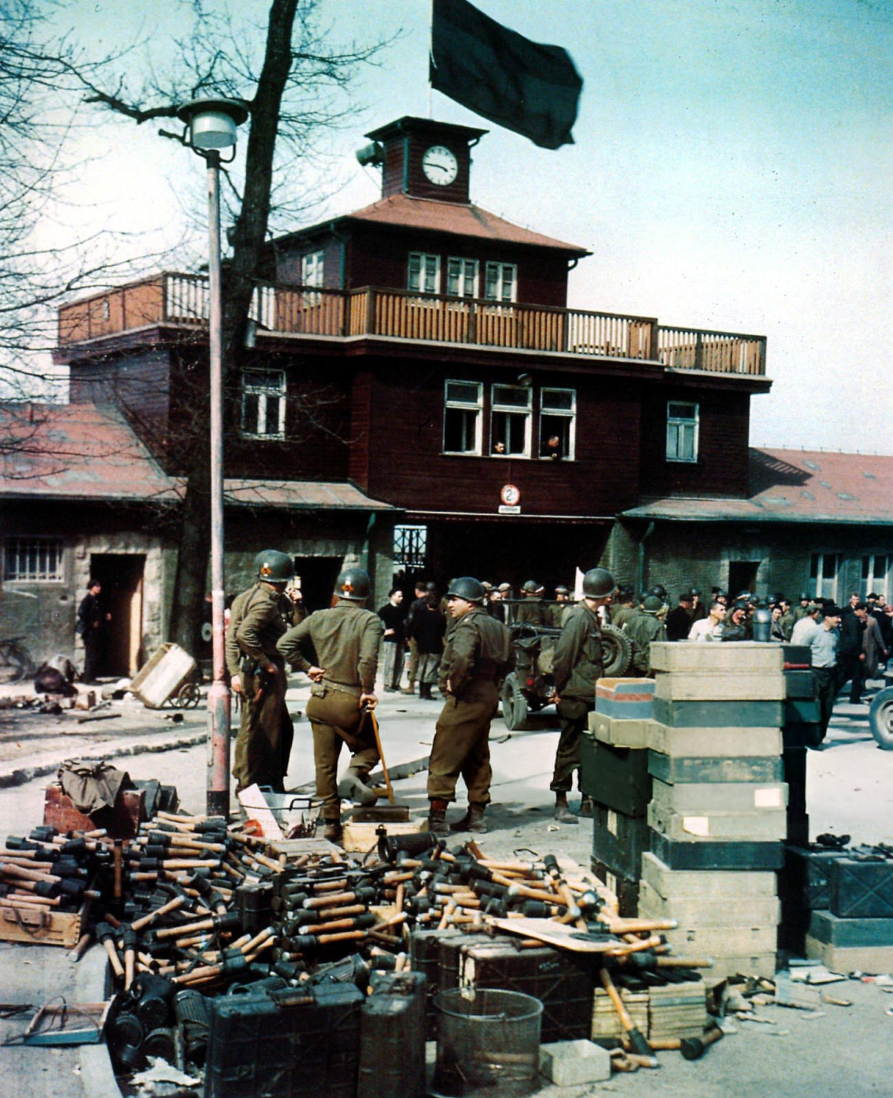 #29 Members of the US 5th Ranger Infantry Battalion outside the newly-liberated Buchenwald Concentration Camp, 1945.
