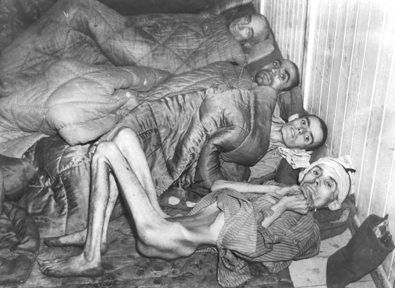 #3 Starved and tortured prisoners await transfer from Buchenwald after their liberation by allied troops, 1945.
