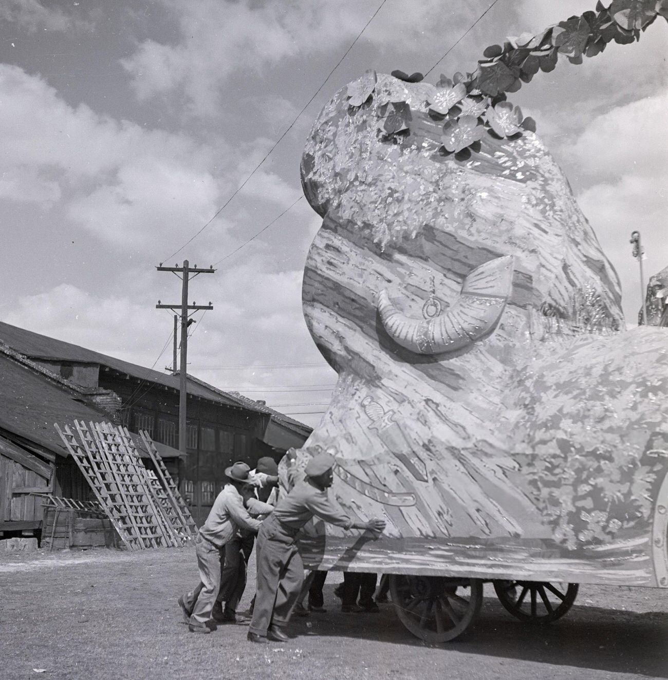 #23 A Group of Men Store a Mardi Gras Float in a Warehouse, 1950s.