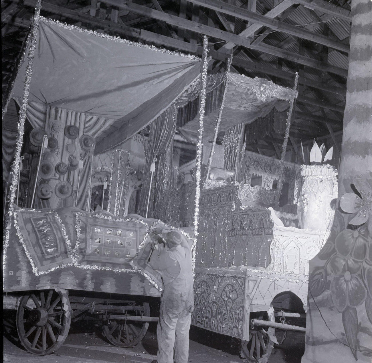 #24 A Man Puts the Finishing Touches on a Mardi Gras Parade Float, 1950s.