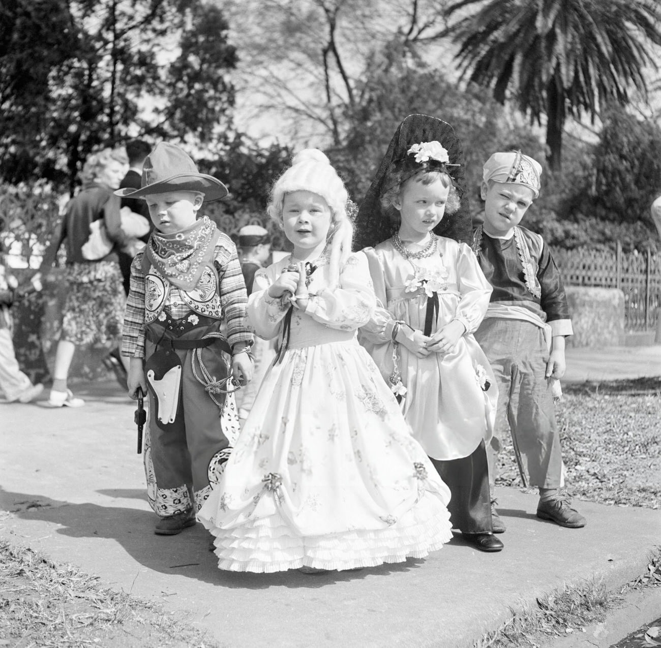 #34 A Group of Boys and Girls Dressed Up as Pirates, Cowboys, and Princesses for Mardi Gras, 1950s.