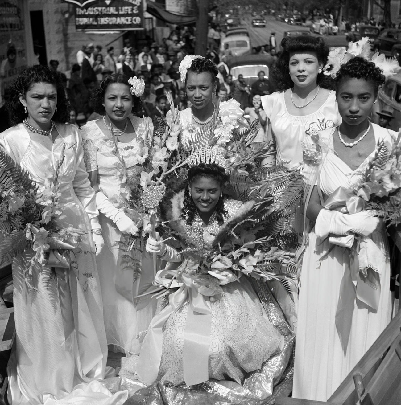 #38 Six African-American Mardi Gras Princesses Ride a Parade Float in Their Formals, 1950s.