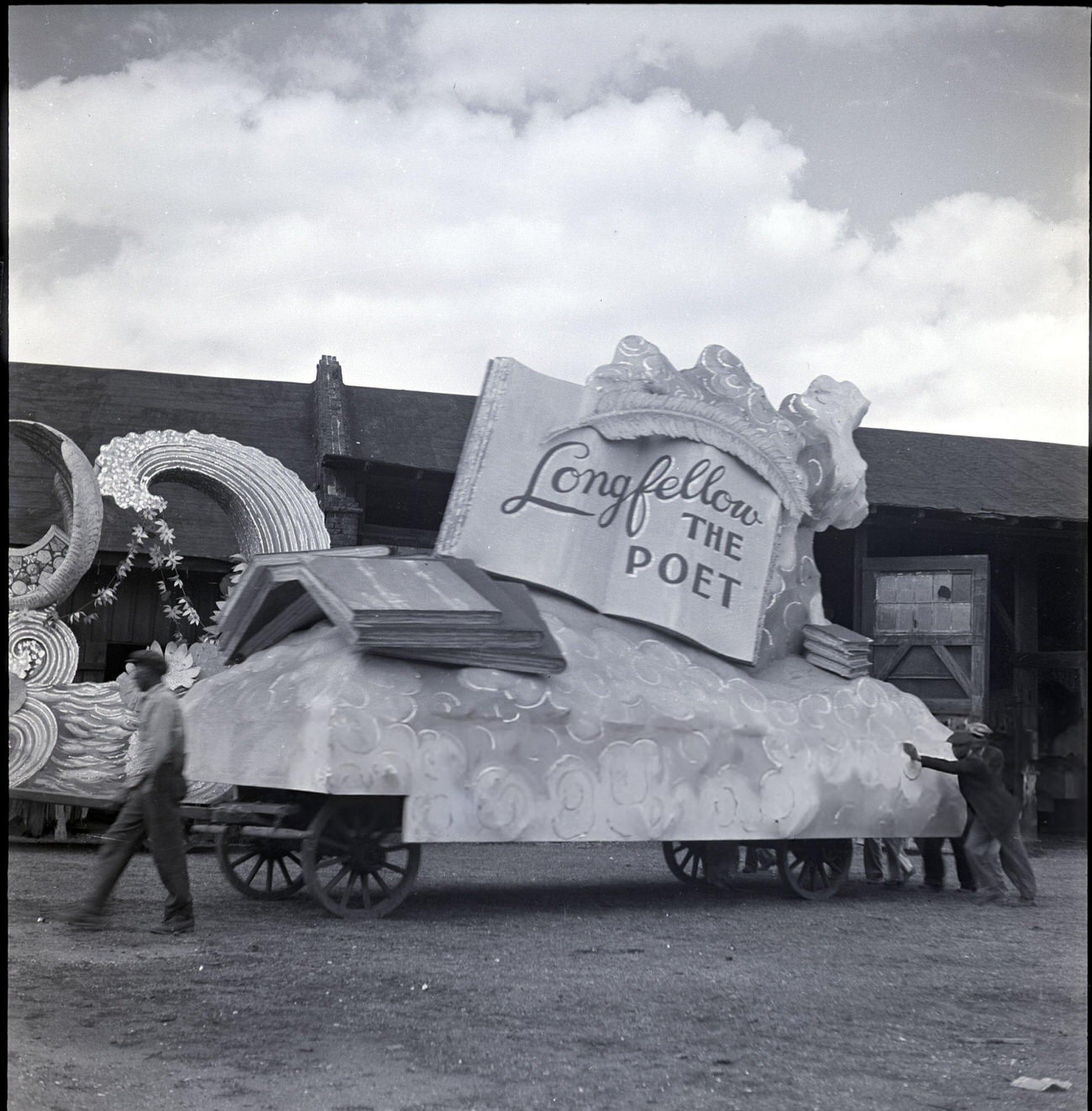 #45 Men Push a Mardi Gras Parade Float, Dedicated to Longfellow, Out of a Warehouse, 1950s.