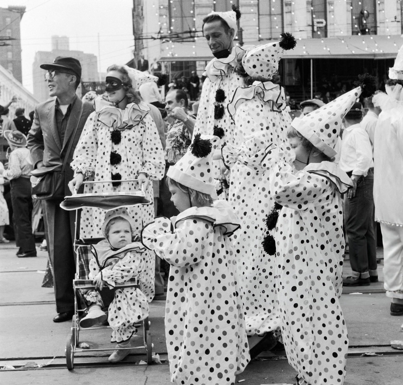 #60 A Family in Fancy Dress Dressed Identically as Clowns at the Mardi Gras, 1950s.