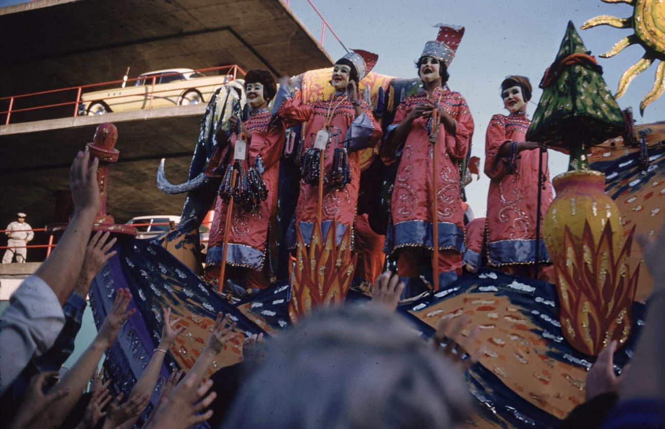 #66 Figures on a Float Being Greeted by the Crowd in a Mardi Gras Procession in New Orleans, 1961.