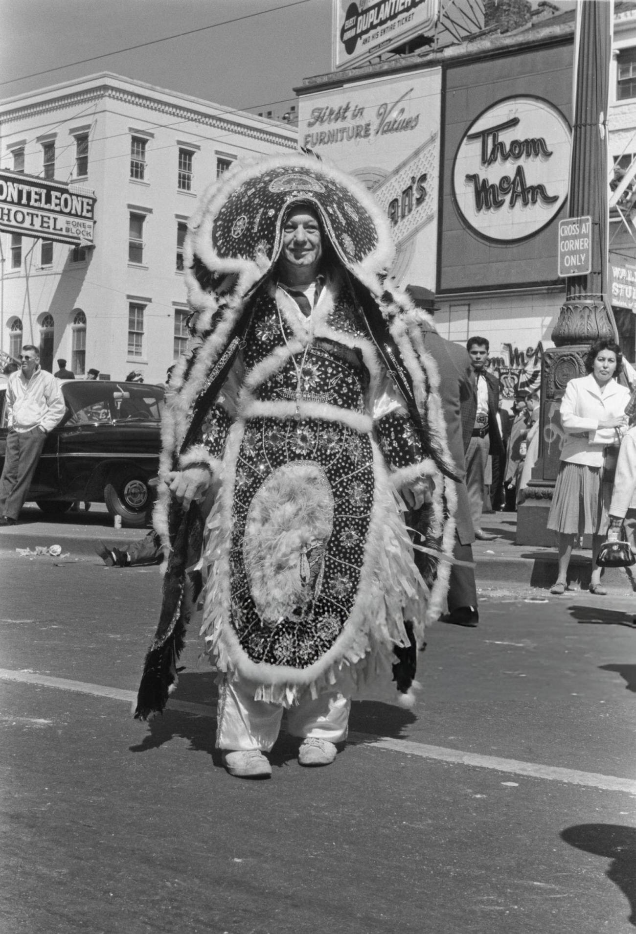 #73 A Man in an Ornate Embroidered Costume on Canal Street During the Rex Parade, 1962.