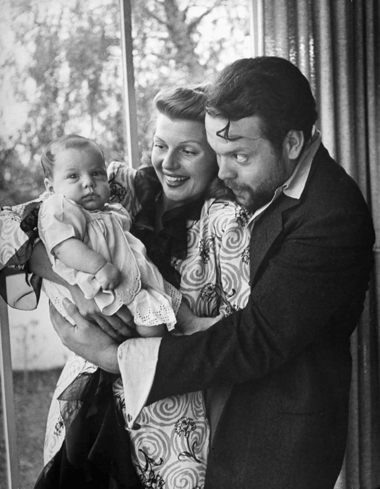 #2 Rita Hayworth and Orson Welles with their daughter, Rebecca Welles, 1944.