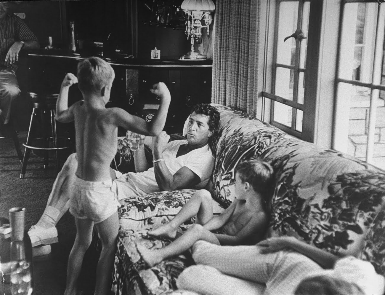 #6 Dean-Paul Martin showing off his muscles to his father, Dean Martin, and brothers Ricci and Craig, 1958.