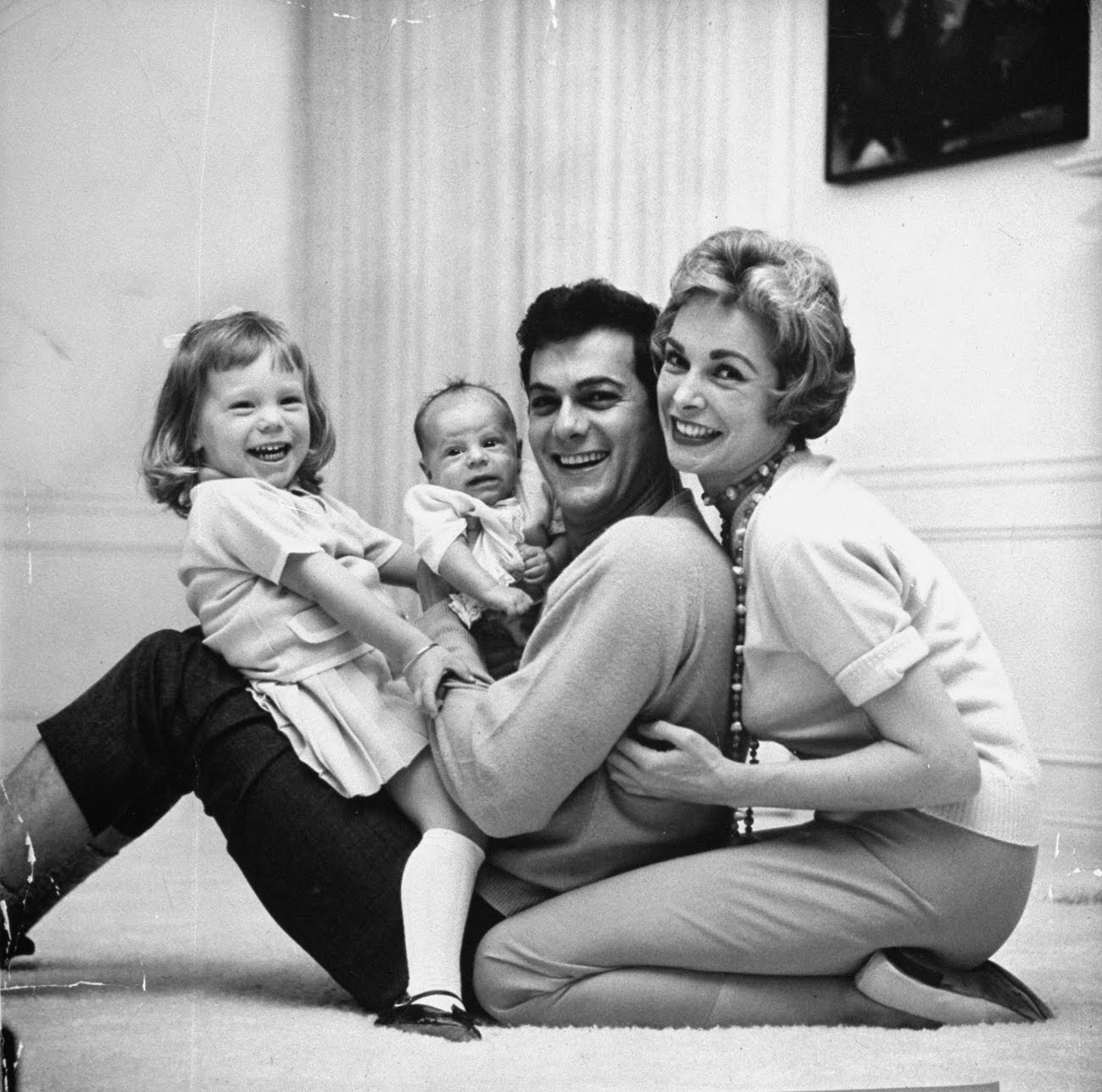 #8 Tony Curtis and Janet Leigh playing with their daughters, Kelly Curtis and Jamie Lee Curtis, 1959.