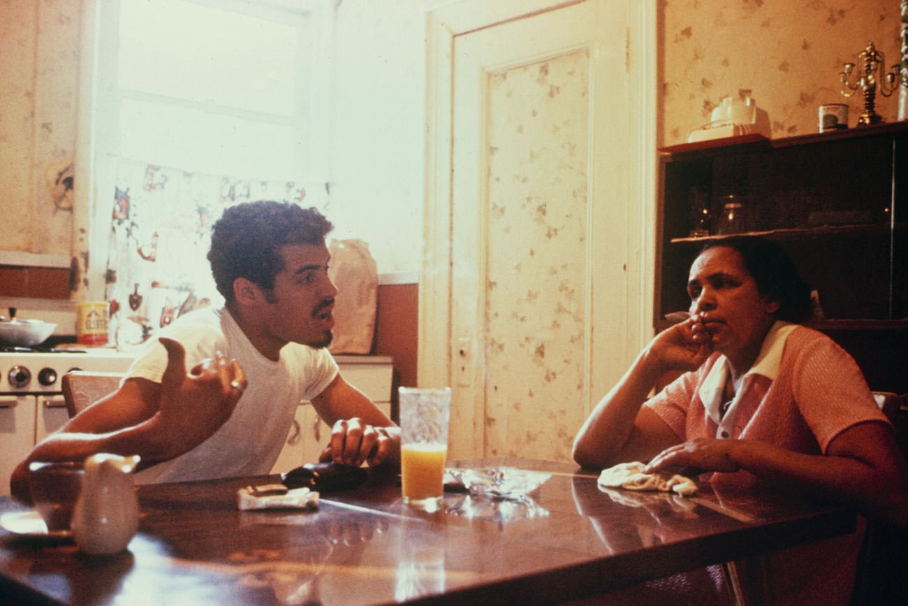 #9 Reapers president Eddie Cuevas and his mother in their South Bronx apartment, 1972.