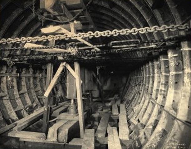 #11 Subway Construction: North tube, looking East. Circular tunnel with chains running across. February 1906.