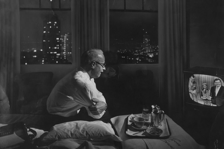 #10 A traveling businessman watches TV in a hotel room in 1958