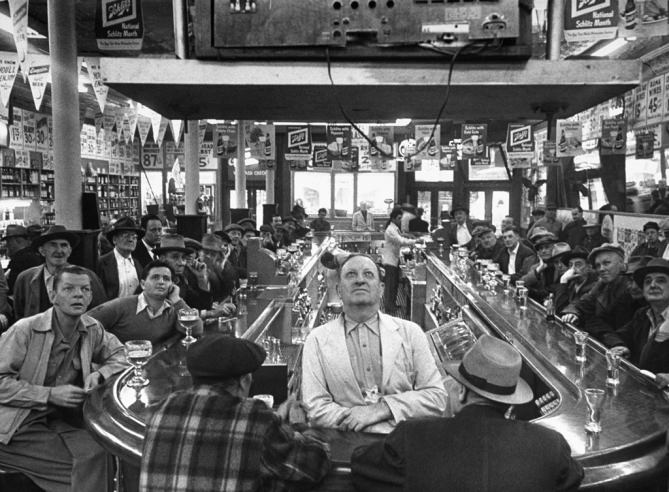 #17 A rapt audience in a Chicago bar watches the 1952 World Series between the Dodgers and Yankees. (The Yankees won)