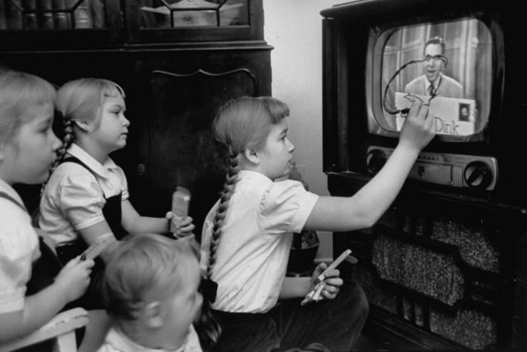 #8 Six-year-old girls use a “Winky Dink” drawing kit on their home TV screen as they watch the kids’ program.