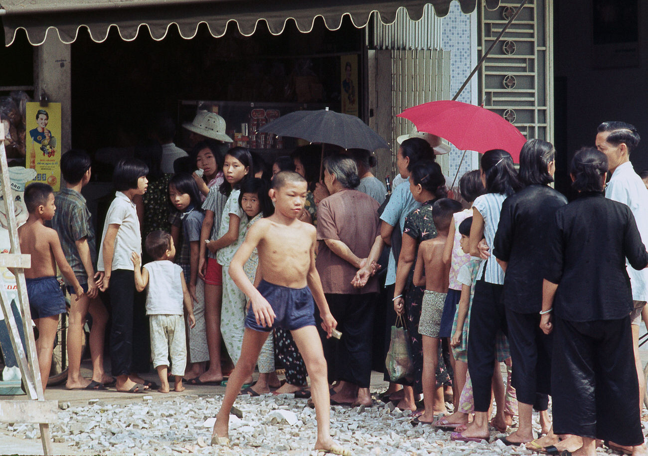 #142 A vendor on Le Loi Street, 1968.