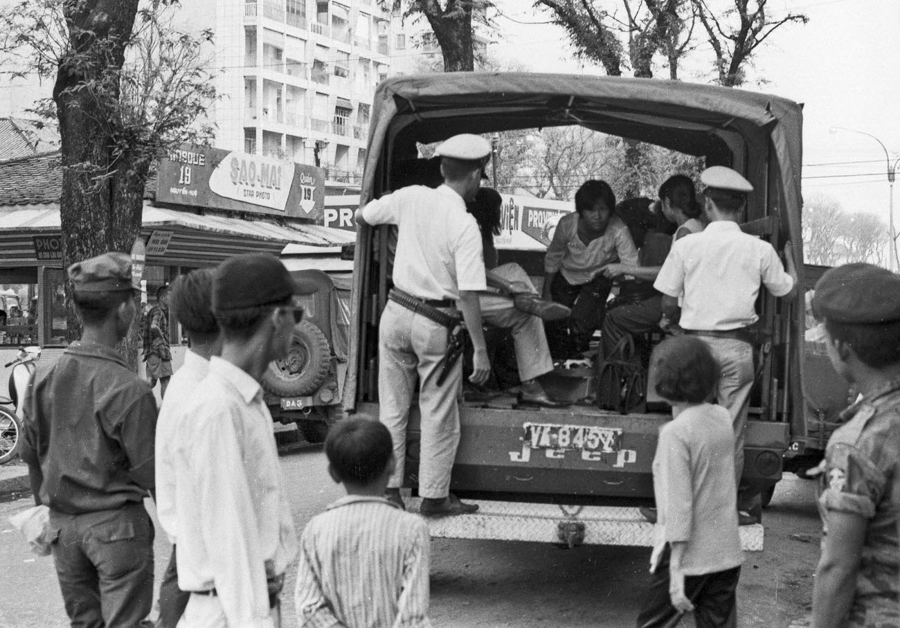 #38 A motorcycle police officer on Nguyen Hu Street in Saigon, 1968.