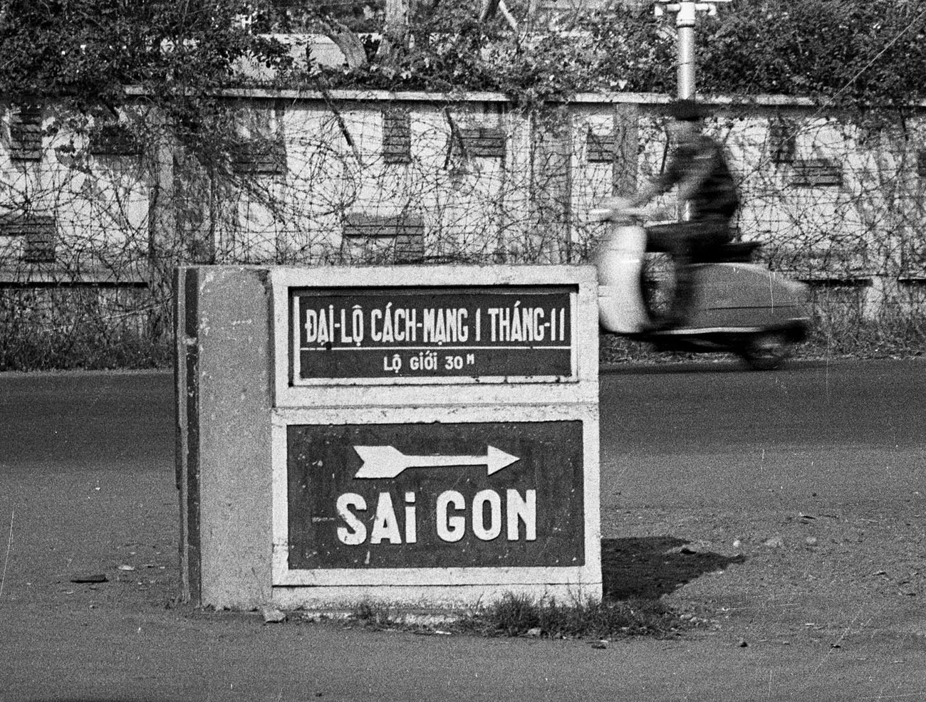 #58 A road marker in Saigon, 1968.