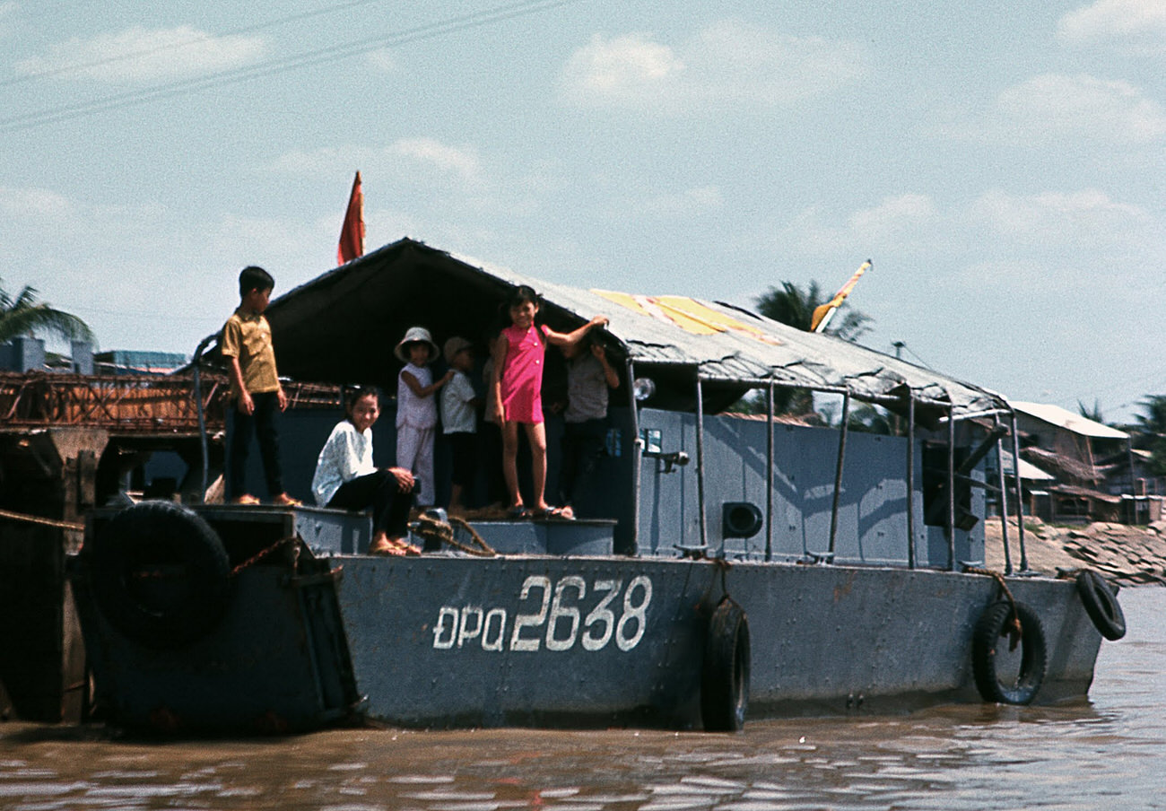 #67 A family on the Saigon River, 1968.