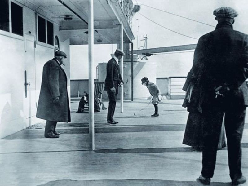 #3 A boy plays aboard the deck of the Titanic.