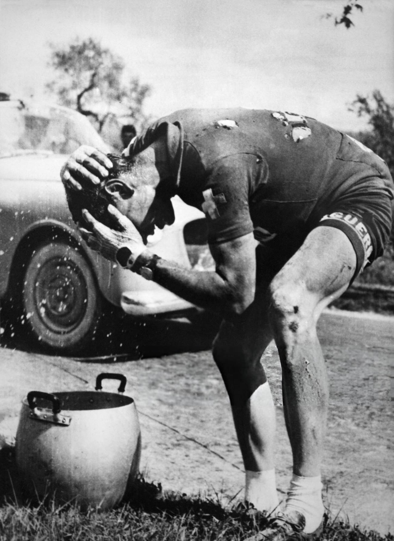 Hugo Koblet refreshing his head after a fall during the Tour d’Italie, 1953.