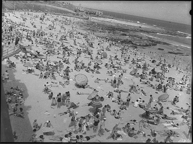 #9 Newcastle Beach on Christmas Day, 1954.