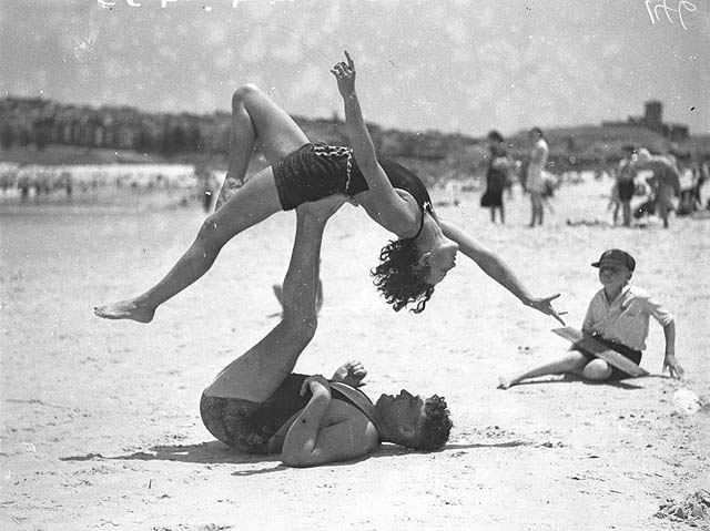 #12 Mr. J. Prentice and Miss J. Howat doing acrobatics at Bondi Beach, January 1935.