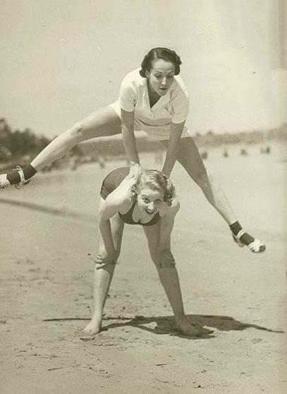#18 Valerie Hays from the cast of ‘Over She Goes’ being leapfrogged, 1937.