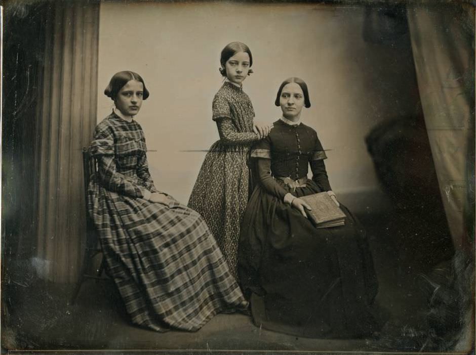 #40 An unidentified group of three young women.